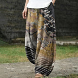 Coralie – Pantalon large doré à motif de grues et de nuages
