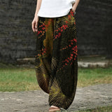 Camille – Pantalon large vert foncé à motif botanique