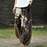 Delphine – Pantalon large blanc à motifs floraux